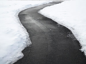 Winding,Pedestrian,Sidewalk,With,Snow,Removed,,Maintenance,Of,Slippery,Surface