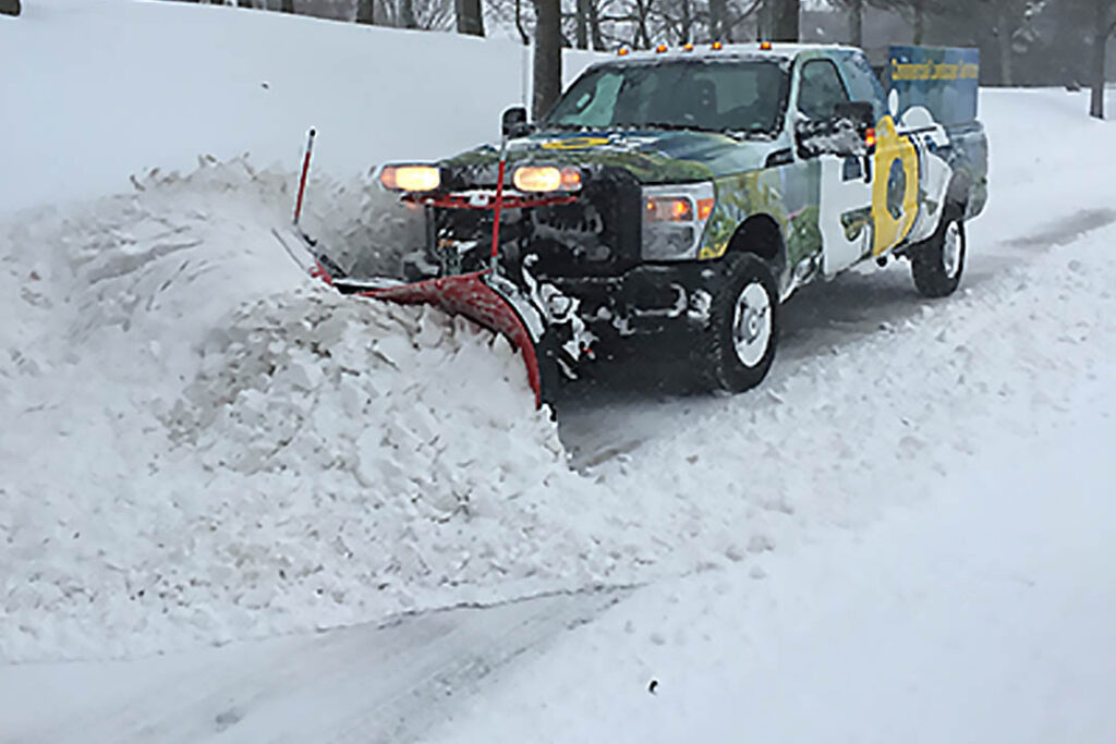 Commercial snow plowing service for parking lots and access roads in Howard County Maryland by eos Outdoor Services